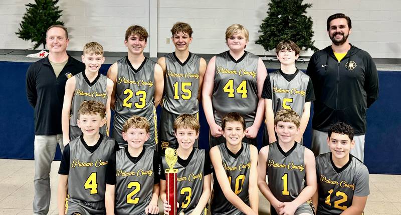 The Putnam County eighth-grade basketball team defeated host Academy of St. Carlo Acutis 41-22 to capture the Fall Class at JA Happ Gymnasium on Saturday, Nov. 22. Team members are (front row, from left) Garrett Billups, Davis Carlson, Cayden Bush, Hayden Doyle, Anthony Popurella and Geoffrey Pagani; and (back row) Coach Brett Carlson, Calvin Fiedler, Luke Gabrielse, Nolan Weddell, Brendan Linton, Camden Moriarty and Coach TJ Askeland. Not pictured: Eli Pennell and Caius Luncsford.