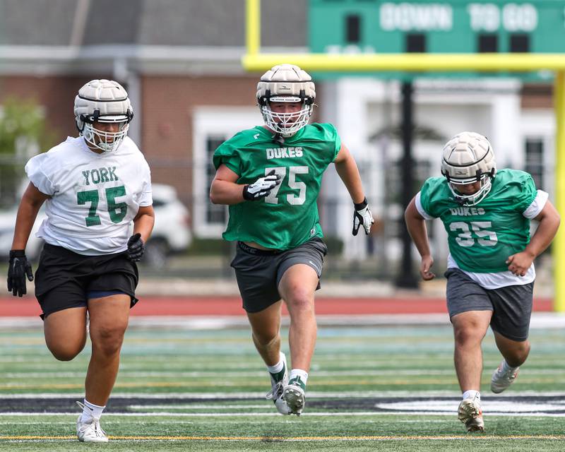 Joe Reiff goes through conditioning drills with the rest of the team at York High School first day of football practice. Aug 12, 2024.