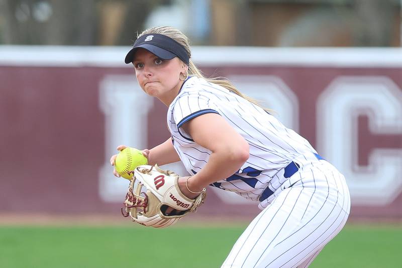 Lincoln-Way East’s Mackenzie Bacha throws to first for the out against Lockport on Monday, April 13, 2026 in Lockport.