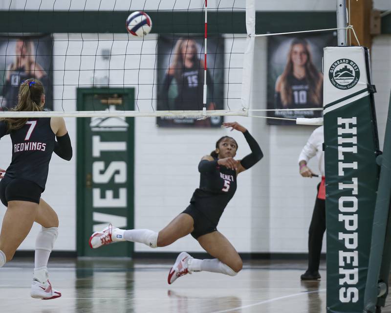 Benet's Brooklynne Brass (5) dives for a dig save during Class 4A Glenbard West Sectional final volleyball match between St Charles North at Benet. Nov 6, 2025 in Glen Ellyn.