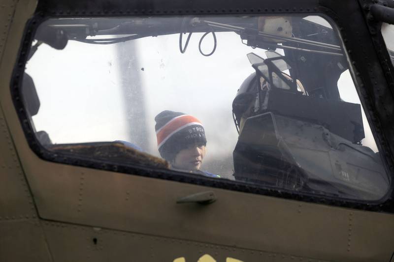 Samuel Gilbert, 9, checks out the cockpit of the warship Tuesday, Nov. 11, 2025, that sits on display at Veterans Memorial Park in Dixon.