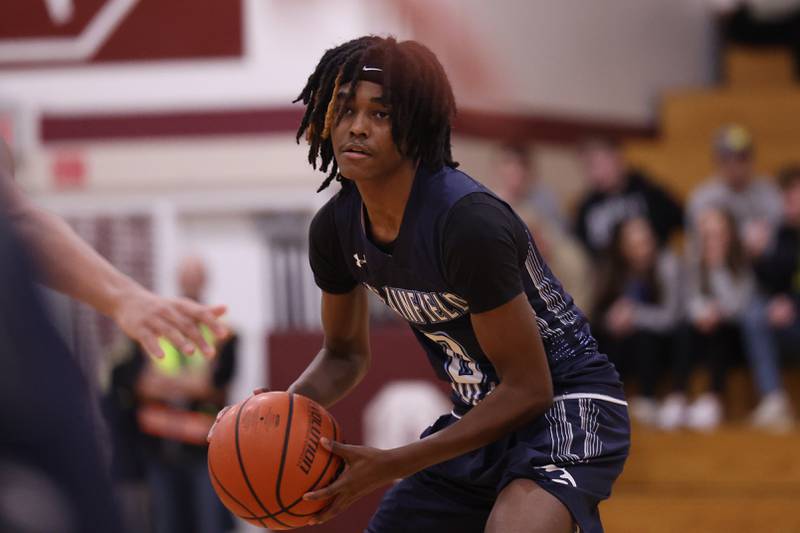 Plainfield South’s Michael Smith II looks for a play against Lockport on Wednesday January 25th, 2023.