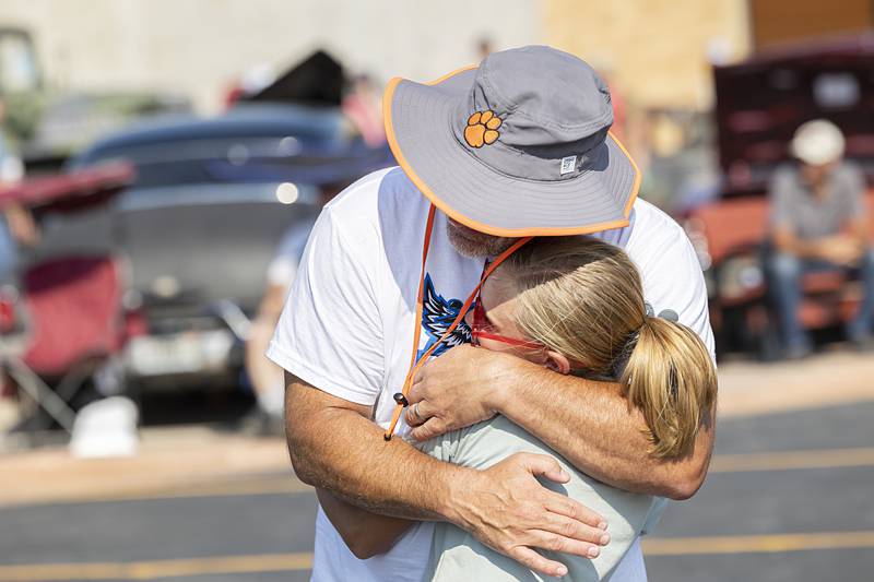 Mark Ward hugs and congratulates daughter Kinsley, 10, after she won an award Sunday, Aug. 25, 2024, at Amboy’s Depot Days.