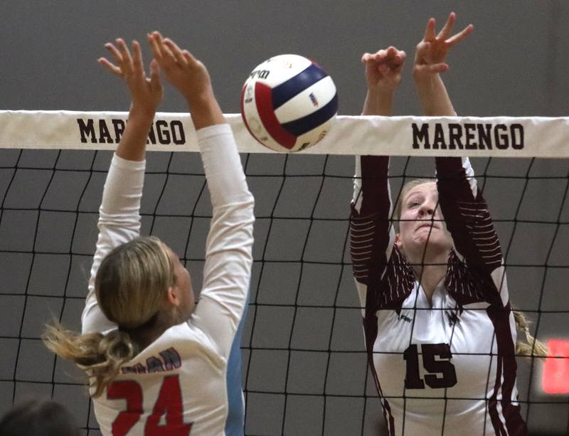Marengo’s Dayna Carr, right, tips the ball past Marian Central’s Caroline Conner in IHSA Class 2A Regional volleyball action on Monday, Oct. 28, 2024, at  Marengo High School  in Marengo.