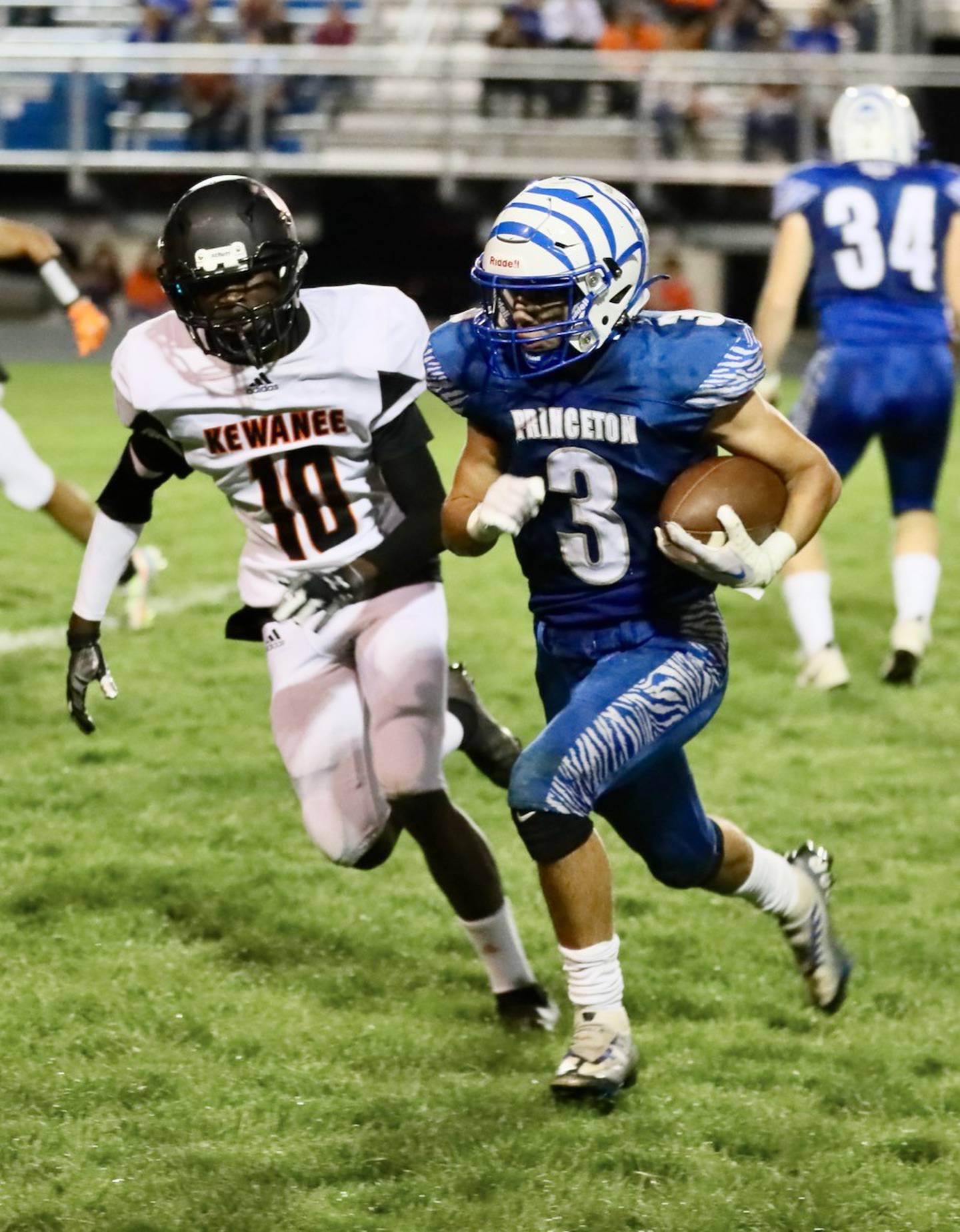 Princeton's Ace Christiansen races away from Kewanee's Dontaveon Thomas Friday night at Bryant Field.