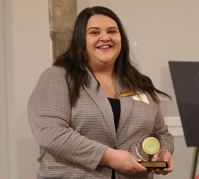 Aleigh Day, Assistant Branch Manager, Heartland Bank and Trust, poses for a photo with her award during the Illinois Valley Chamber of Commerce 40 Under Forty Awards Gala on Thursday, Feb. 9, 2023 at Westclox in Peru.
