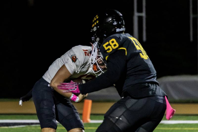 Joliet West's Savon Jamison sacks Plainfield East's Brady Cloherty during a varsity football game at Joliet West on Oct. 10, 2025.
