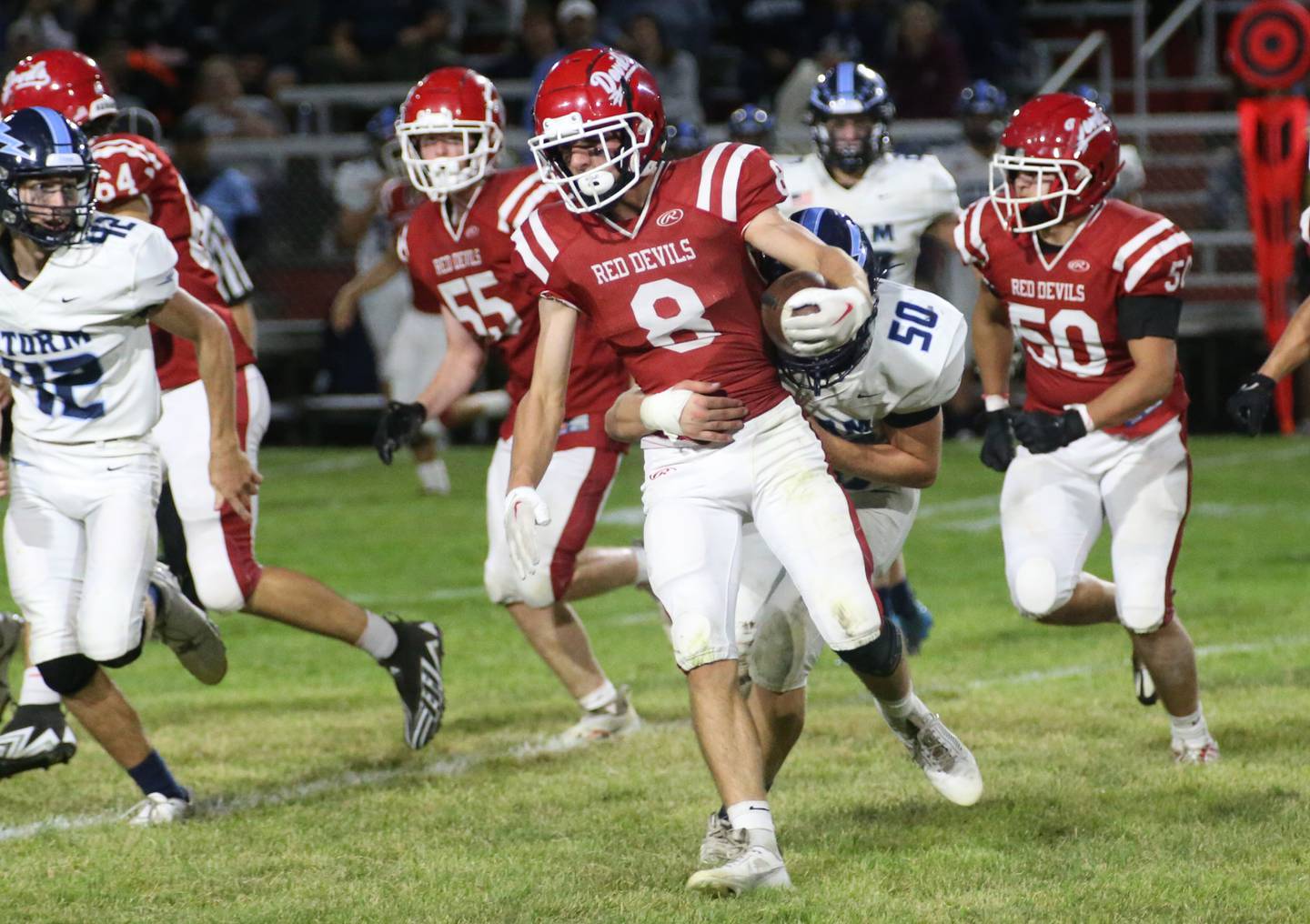 Hall's Braden Curran carries the ball while being brought down from behind by Bureau Valley's Connor Scott on Friday, Sept 8, 2023 at Richard Nesti Stadium.