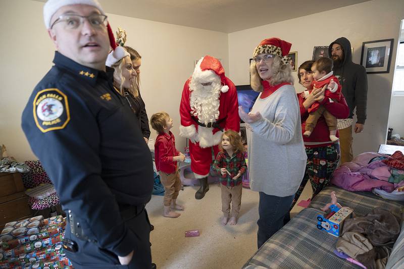 Santa chats with excited kids at one of the Operation Santa stops Monday, Dec. 23, 2024, in Rock Falls.