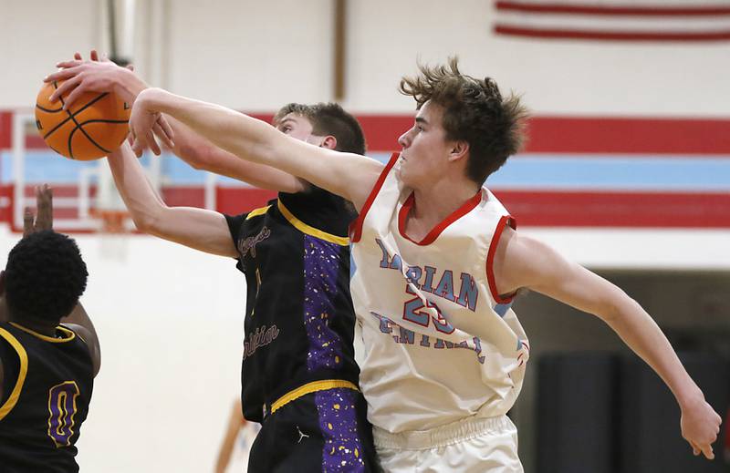 Marian Central's Finn Pivnicka (right) battles with Chicago Christian's Eddie VanDellen for a rebound during a Chicagoland Christian Conference basketball game on Tuesday, Jan. 21, 2025, at Marian Central High School.