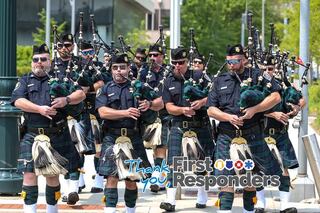 Joliet police pipe and drum band plays on