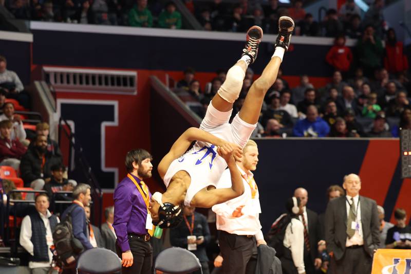 Warren’s Caleb Noble celebratory flip after his win over Hononega’s Rocco Cassioppi in the 106-pound Class 3A state championship match on Saturday, Feb. 17th, 2024 in Champaign.