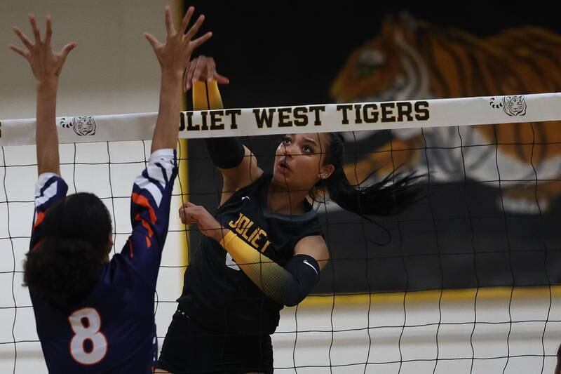 Joliet West’s Faith Jordan follows through on a kill against Romeoville on Thursday, Sept. 5, 2024 in Joliet.