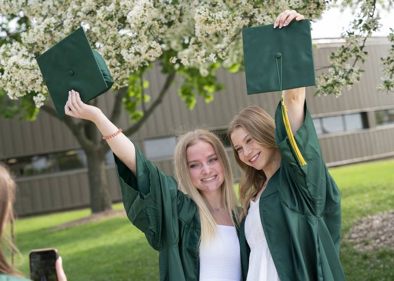 Graduates Grace Goerges, left, and Julia Fronczak pose for a photo before a graduation ceremony for the class of 2022 on Saturday, May 14, 2022, at Crystal Lake South High School in Crystal Lake.