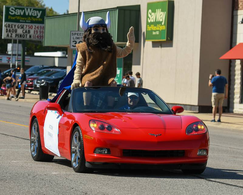 Victor the Viking waves to the crowd during the Geneva High School Homecoming Parade on Friday, Sept. 26, 2025, along State Street in downtown Geneva.