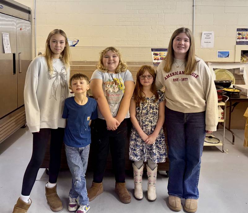 (From left) Ellie Wilkins, Conor Obodzinski, Addy Wilkins, Lucy Obodzinski, and Reese Harkins helped serve the meal on Tuesday.