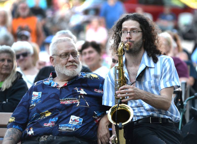 Ed Chodl of Mt. Morris watches Jonny Lyons and the Pride saxophonist Maxwell Meador perform at the Mt Morris Jamboree on Friday, June 27, 2025.