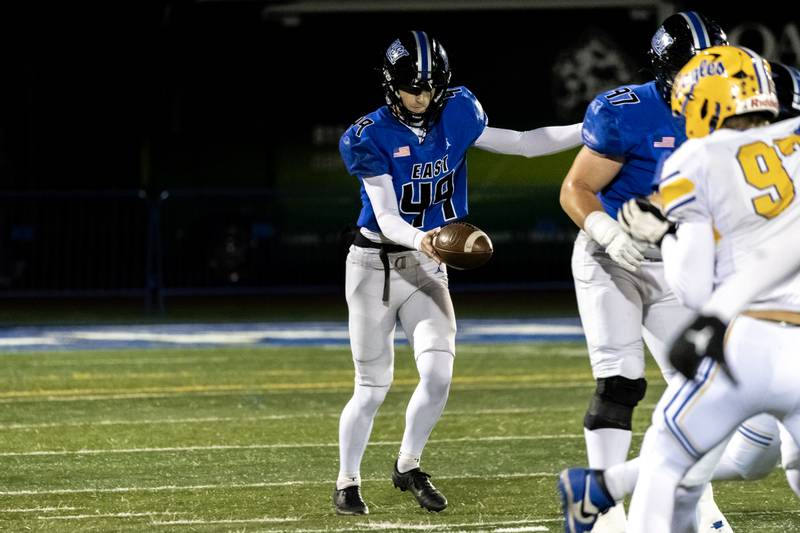 Lincoln-Way East's Grant Urban prepares to punt during a varsity football game against Sandburg at Lincoln-Way East on Oct. 23, 2025.
