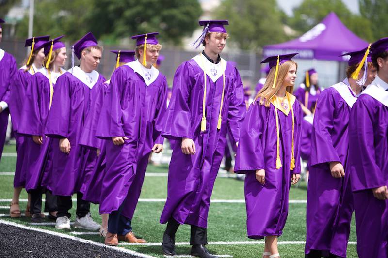 Downers Grove North graduates  line up for their diploma at the Commencement Ceremony on Sunday, May 18, 2025 in Downers Grove.