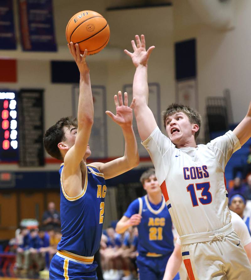 Genoa-Kingston's Conner Harney tries to block the shot of Aurora Central Catholic's Ben Bohr Monday, Feb. 23, 2026, during their IHSA Class 2A regional quarterfinal at Genoa-Kingston High School.