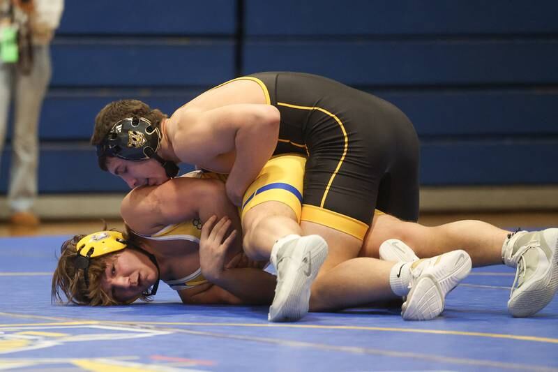 Joliet West’s Jacob Tyderek works over Joliet Central’s Xavier Eggert in the 190-pound weight match at Joliet Central on Friday, Jan 31, 2025.