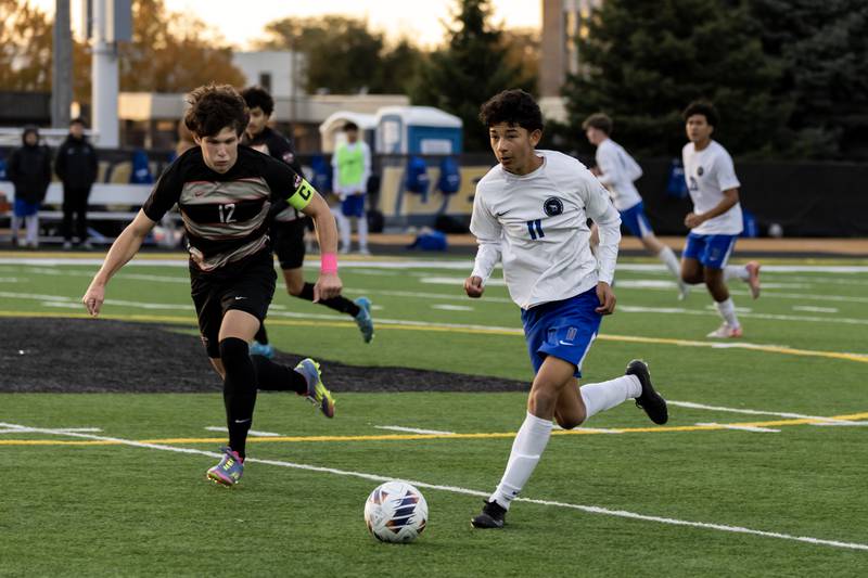 Lincoln-Way East's Mateo Espinosa looks downfield during the 3A Joliet West Sectional boys varsity soccer match against Lincoln-Way Central at Joliet West on Oct. 29, 2025.
