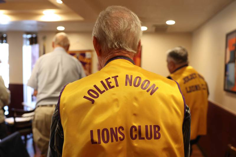 Members of the Joliet Noon Lions Club stand for the Pledge of Allegiance before the start ofits meeting on Thursday, Sept. 22, 2022, at the Silver Spoon restaurant in Joliet. The Joliet Noon Lions Club, a community outreach organization, celebrated its 101st anniversary this year.