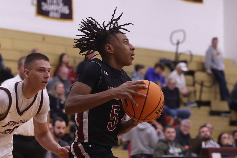Plainfield North’s Darin Ashiru looks to make a play against Lockport on Friday, Jan. 3, 2025 in Lockport