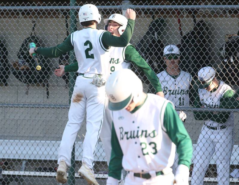 St. Bede's Gus Burr chests bumps teammate Ryan Slingsby after scoring a run against Indian Creek  on Thursday, March 28, 2024 at St. Bede Academy.