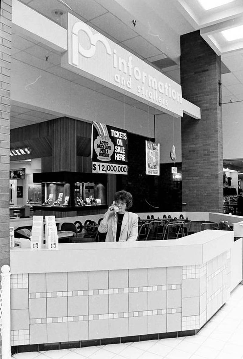 A view of the information desk at center court at the Peru Mall in the 1980's.