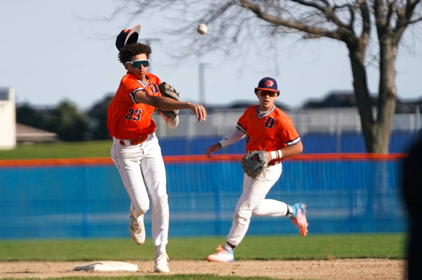 Oswego’s Kamrin Jenkins (23) fields a grounder and throws to first for an out against Plainfield East during a baseball game at Oswego High School on Tuesday, April 9, 2024.
