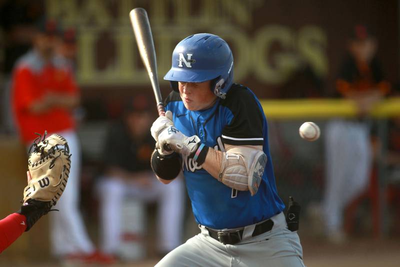 St. Charles North's Mason Netcel gets hit with a ball during a game against Batavia on Thursday, April 24, 2025 in Batavia.