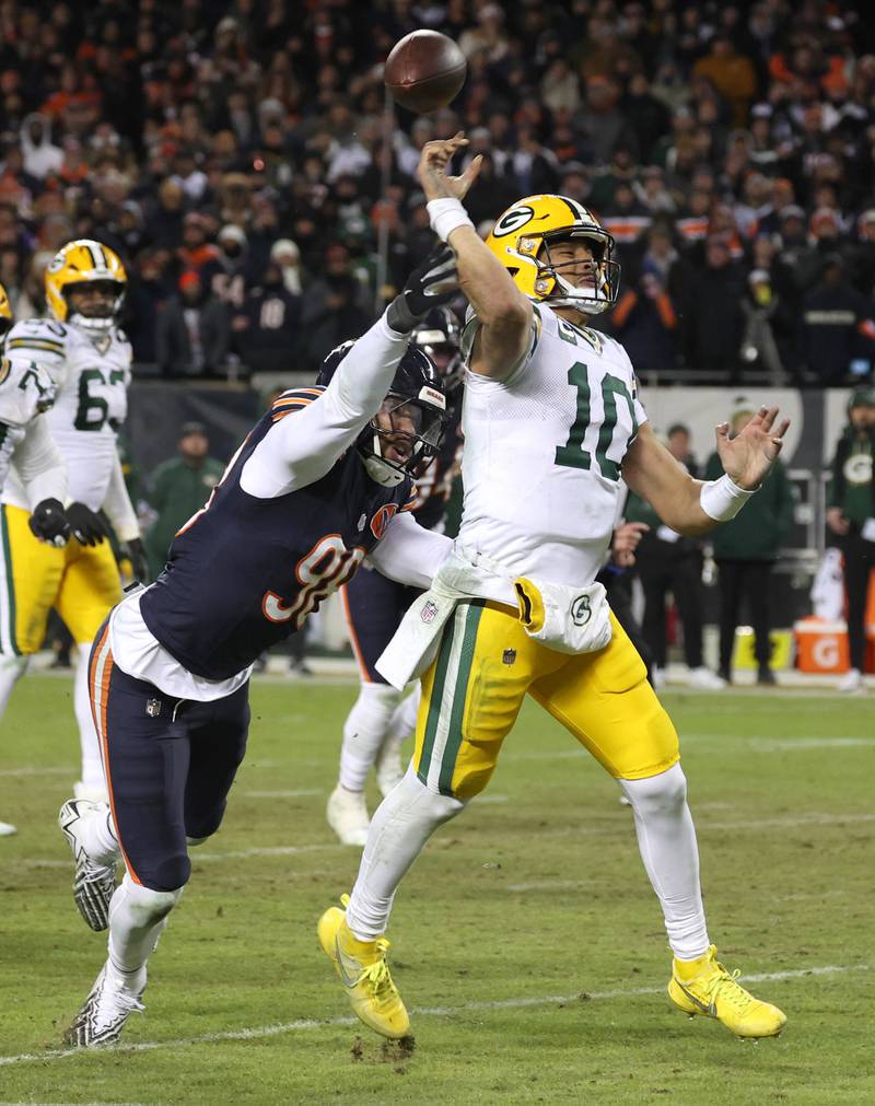 Chicago Bears defensive end Montez Sweat hits Green Bay Packers quarterback Jordan Love as he throws during the Packers last drive in the Bears NFL Wild Card game win Saturday, Jan. 10, 2026, at Soldier Field in Chicago.