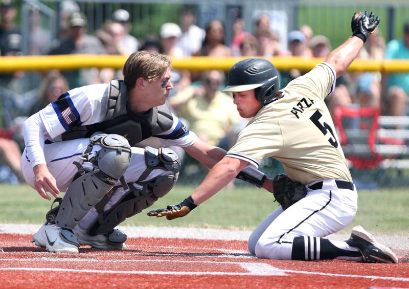 Sycamore's Owen Piazza is tagged out trying to score by Burlington Central's Jake Johnson during their Class 3A sectional final game against Sycamore Saturday, June 3, 2023, at Kaneland High School in Maple Park.