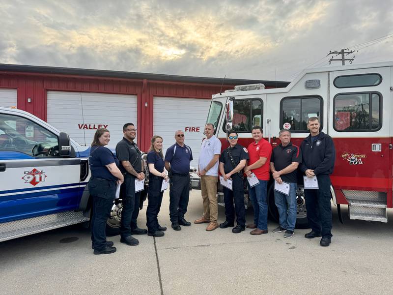 EMT Naomi Falbo, EMT Manny Salano, Paramedic Christy Michael, Ambulance Managing Director Bob Hoscheid, Fire Chief Todd Bogatitus, Lieutenant/ EMT B. Thomas Scholle, Firefighter/ EMT Nathan Diaz, Deputy Chief/ EMT Gregory Lauf and Firefighter/ EMT B. Mark Kramer.