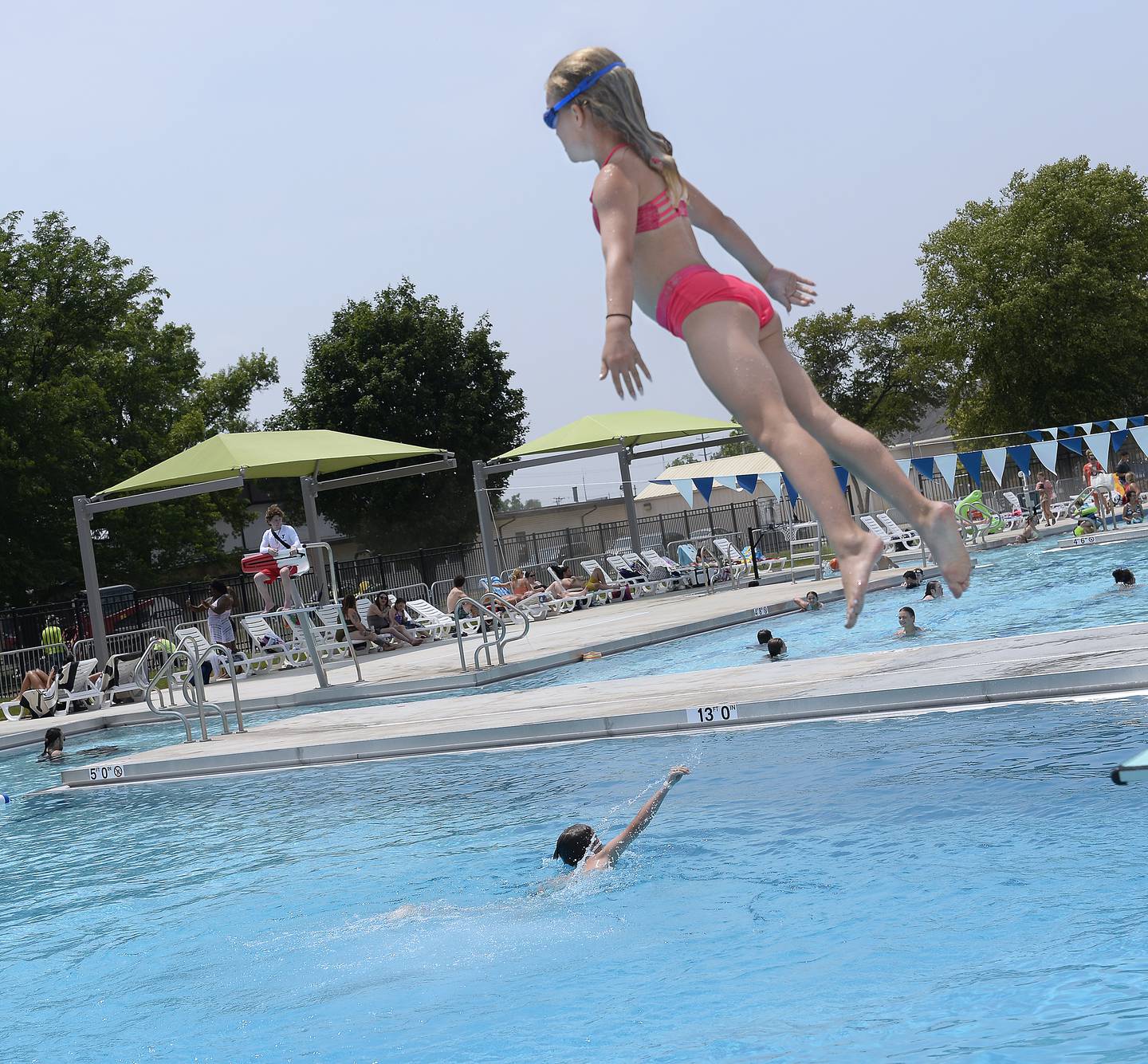 On a perfectly warm summer’s day, the new Riordan Pool in Ottawa saw large crowds enjoying swimming and diving Monday, June 19, 2023.