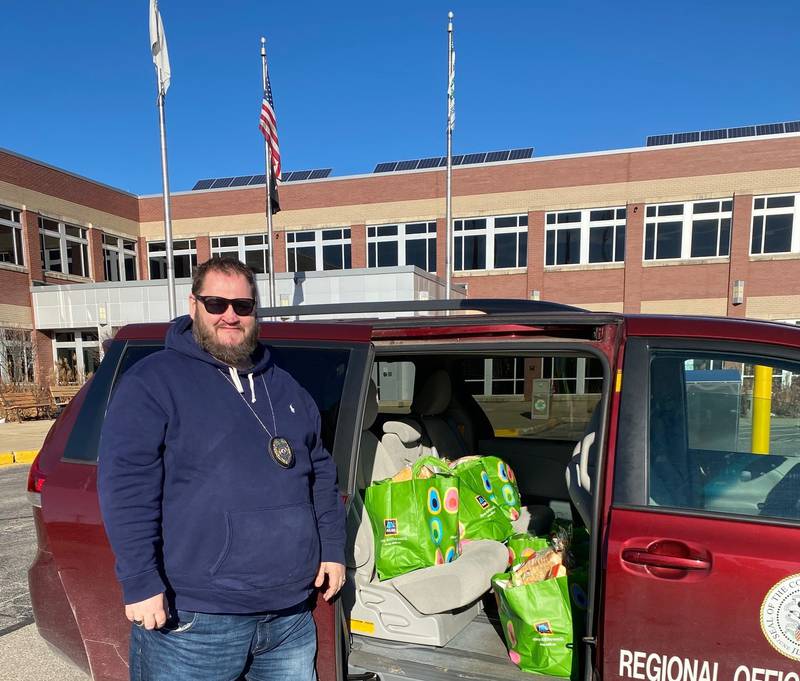 McHenry County Regional Office of Education truancy officer Tim Dempsey has helped garner private donations to provide 25 families holiday meals, six of which are being shown getting delivered Friday.