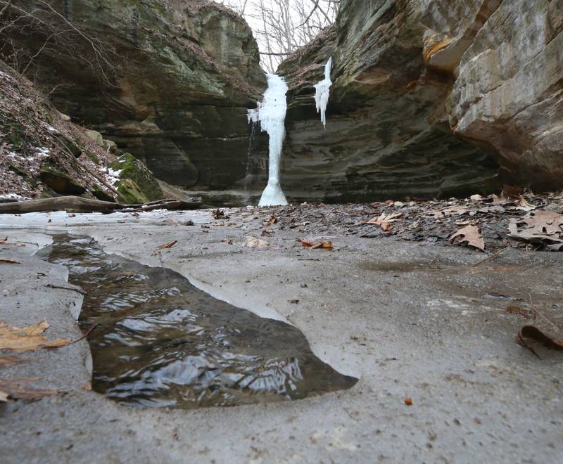 A frozen ice fall is fully intact in Ottawa Canyon on Tuesday, Feb. 7, 2023 at Starved Rock State Park.  Frozen waterfalls are common at Starved Rock and Matthiessen State Parks during the winter season. This year, the ice falls wern't as impressive due to the warmer than normal January. Only a handful of ice climbers were seen in the park this year unlike years past.