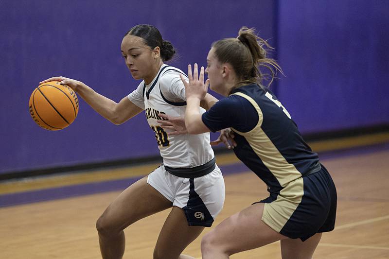 Sterling’s Nia Harris handles the ball against Rockford Christian’s Shea Ludwig  Friday, Dec. 26, 2025, at the Duchesses Basketball Christmas Classic.