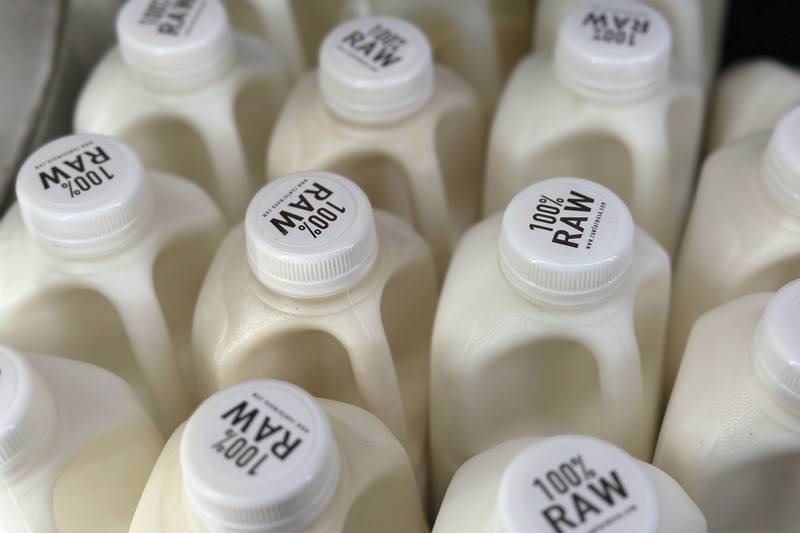 Bottles of raw milk are displayed for sale at a store in Temecula, California.