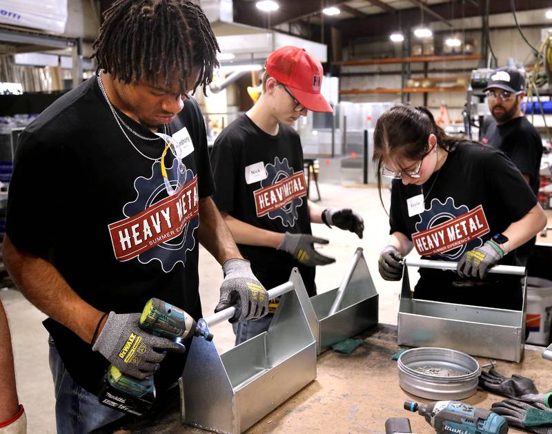 Participants in the Heavy Metal Summer Experience put the finishing touches on a tool box they made Wednesday, June 11, 2025, at DeKalb Mechanical. The program, put on through a partnership between the DeKalb Chamber Foundation and DeKalb Mechanical, offers a hands-on training to high school aged students interested in a career in the trades.