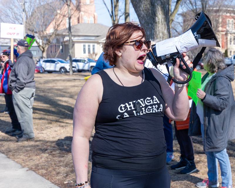 Protester speaks into megaphone at the 'Pretti good time for a Protest' on Feb. 15, 2026 at Washington Square Park in Ottawa.