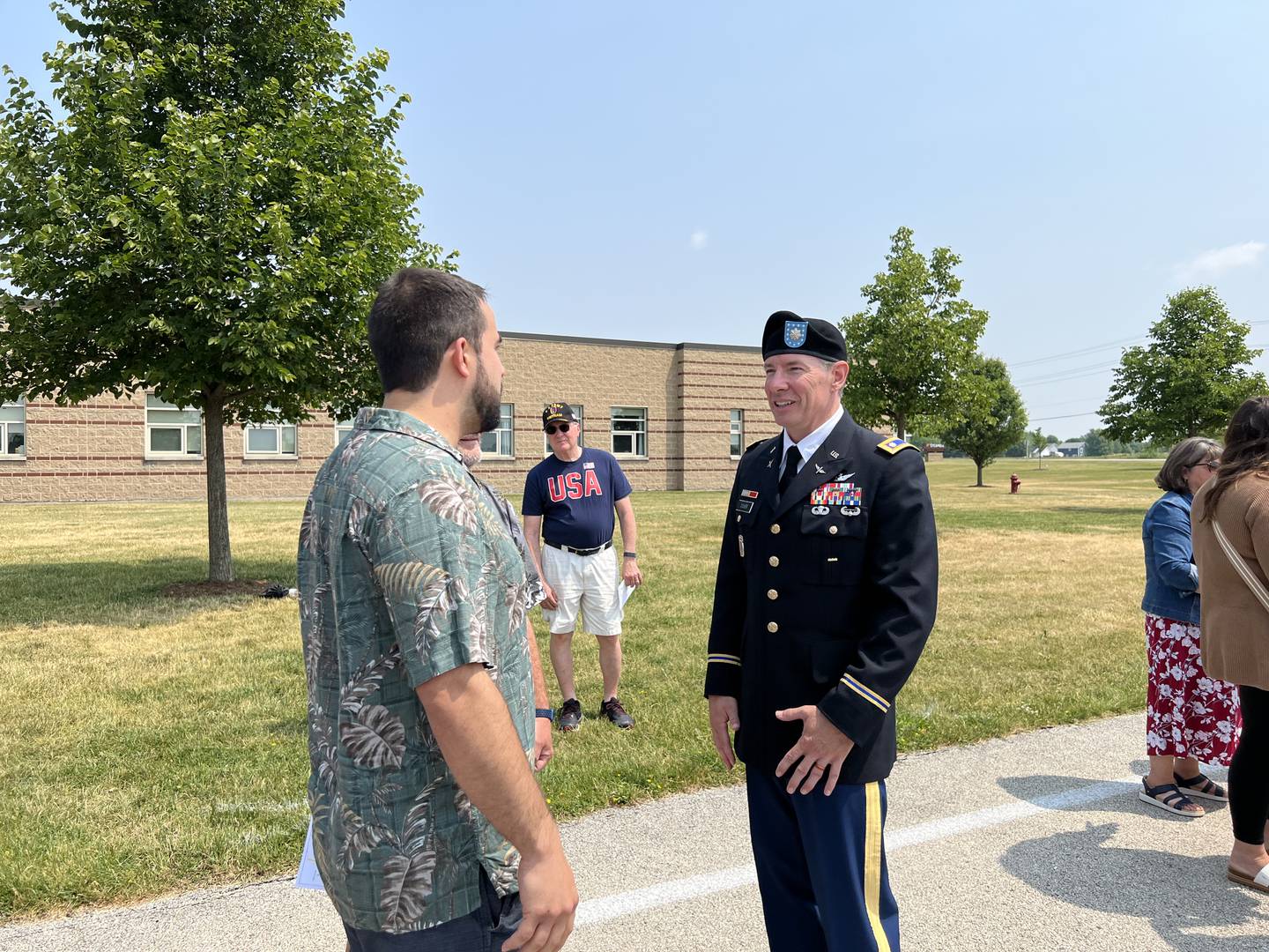 Sycamore Community School District 427 School Board member Michael DeVito talks with retired U.S. Army Lieutenant Colonel David Dosier after the 2023 Flag Day celebration in Sycamore on June 14, 2023.