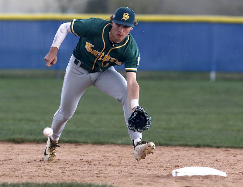 Crystal Lake South's Dayton Murphy tries to field the ball during a Fox Valley Conference baseball game against Crystal Lake South on Friday, April 12, 2024, at Burlington Central High School.