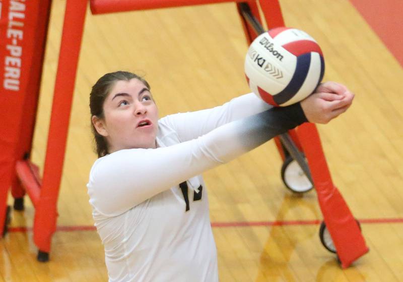Sycamore's Norah Chami saves the ball from going out of bounce against L-P on Tuesday, Sept. 23, 2025 in Sellett Gymnasium at L-P High School.