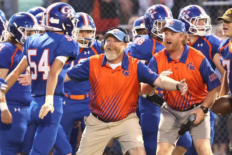 Genoa-Kingston's Connor Grimm celebrates with teammates in the end zone after recovering a fumble and returning it for a touchdown during their game against North Boone Friday, Sept. 9, 2022, at Genoa-Kingston High School.