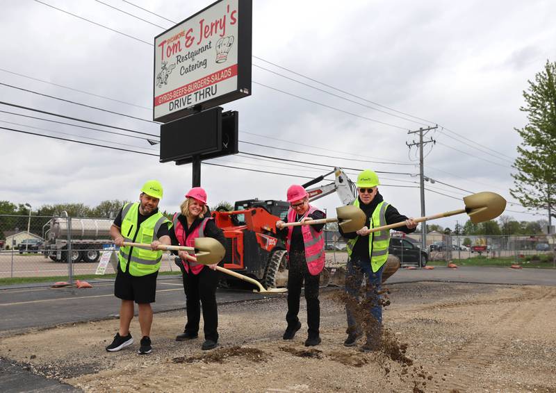 Tom & Jerry’s general manager Josh Osenga, (L-R) general manager Sarah Meyer, owner Diann Beaulieu and owner Thomas Beaulieu throw some dirt Friday, May 1, 2026, during a groundbreaking ceremony to kick off the rebuilding of the restaurant at its previous location of 1670 DeKalb Avenue in Sycamore. Tom & Jerry’s was destroyed by a fire on January 31 and is currently operating at its temporary location at 265 West Peace Road in Sycamore.