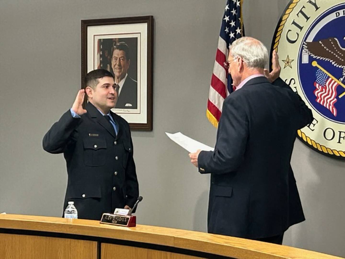 David Robles (left) takes the oath of office as he officially joins the Dixon Fire Department during a ceremony Monday, Feb. 5, 2024, at Dixon City Hall. Mayor Glen Hughes swore Robles onto the department.
