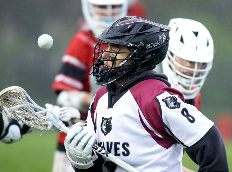 Prairie Ridge’s Nicholas Schons corrals the ball against Huntley  in varsity boys lacrosse at Prairie Ridge  High School in Crystal Lake on Thursday, May 1, 2025.