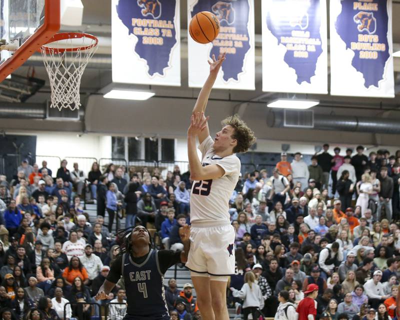 Oswego's Cole Jansons (23) attempts a shot at the basket during their basketball game between Oswego East at Oswego Friday, Jan 09, 2025 in Oswego.